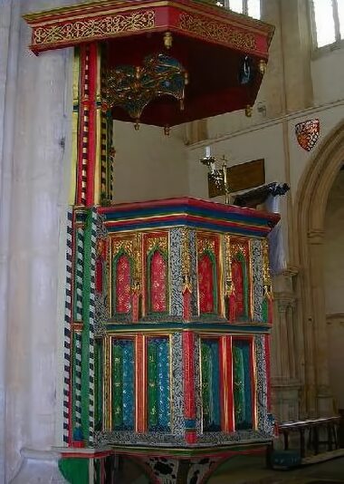 The brightly painted pulpit of the Church